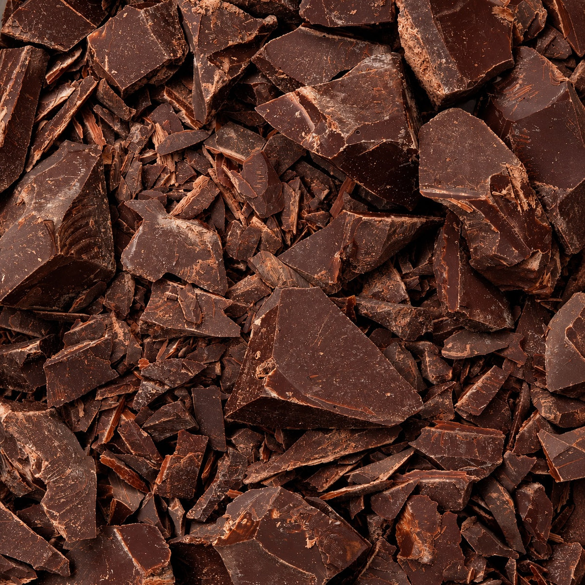 Ceremonial cacao chunks close up [1 bag (450g); 1kg bag; 10 bags (450g); 30 bags (450g); 60 bags (450g)]