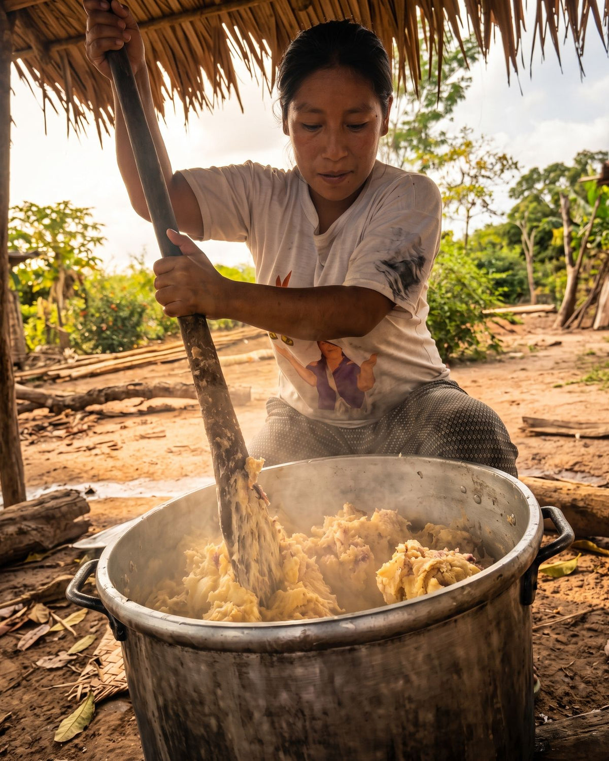 Preparing chicha over the fire